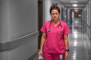Pink Scrubs Nurse in a Cold Landscape
