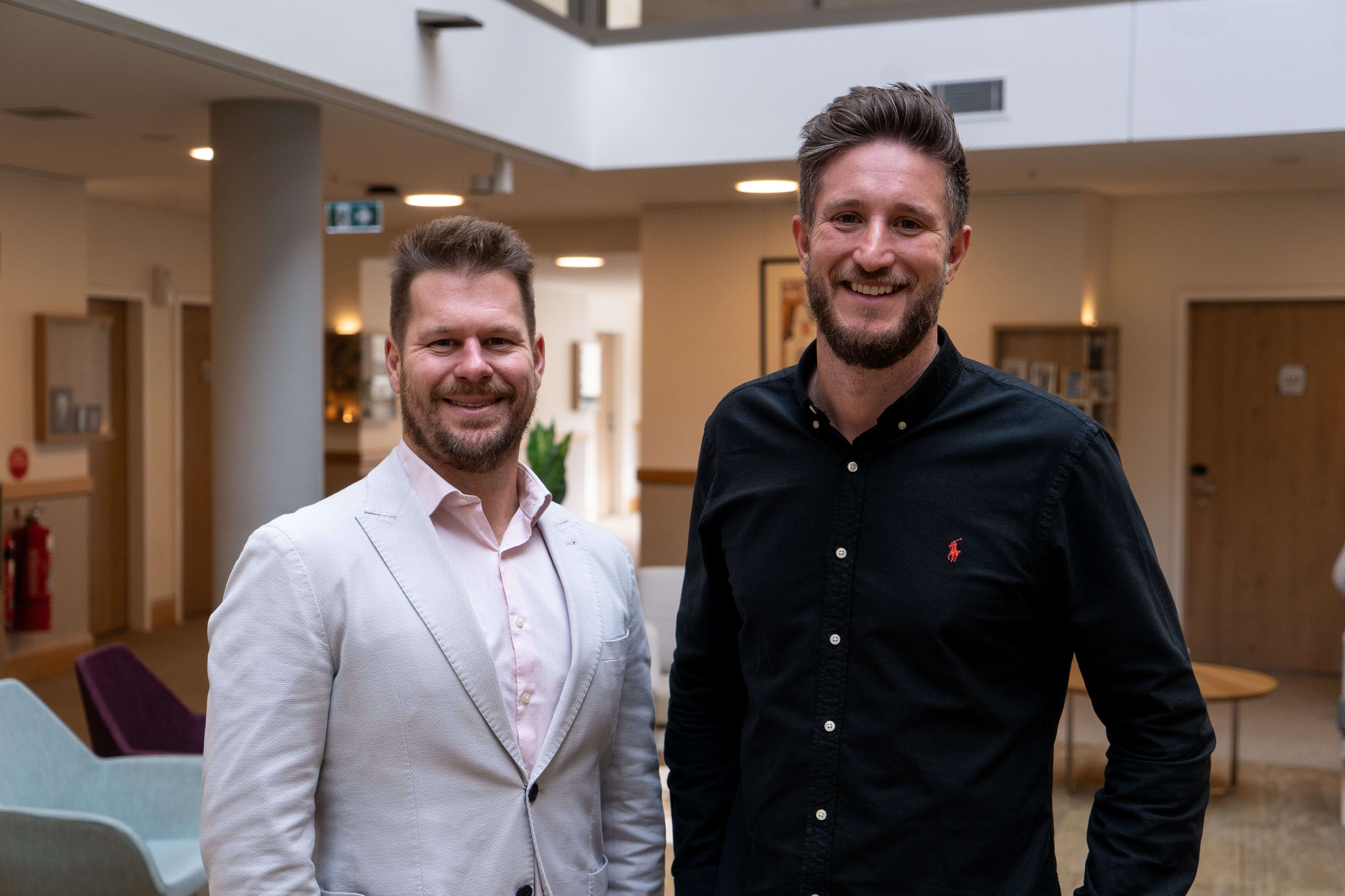 Josh Hill and Edward Freeman smiling to camera in aged care facilitiy 3